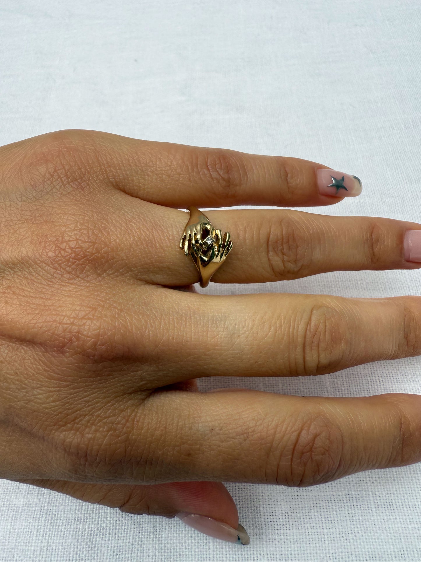 1970's 14K Gold hand and hand ring.